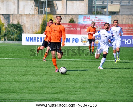 SOCHI,RUSSIA-MARCH 20:7-a-side soccer match Netherlands (orange) VS Iran (white) for people with cerebral palsy on Mar. 20 2012 in Sochi.The tournament is in preparation for Paralympics 2012 in London