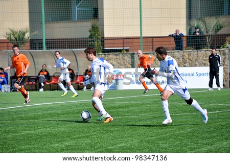 SOCHI,RUSSIA-MARCH 20:7-a-side soccer match Netherlands (orange) VS Iran (white) for people with cerebral palsy on Mar. 20 2012 in Sochi.The tournament is in preparation for Paralympics 2012 in London