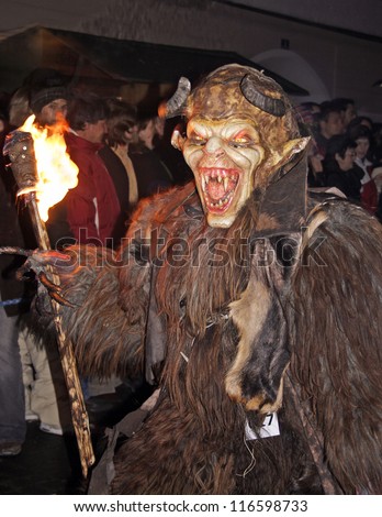 ZELL AM SEE, AUSTRIA - DECEMBER 5: Unidentified man wears Krampus (devil) mask at traditional procession on December 5, 2006 in Zell am See.