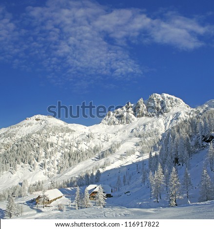 Snowy mountain chalets, Ski resort Nassfeld in winter - Mountains Alps, Austria