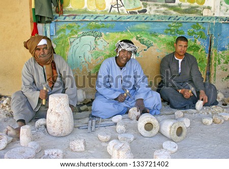 LUXOR, THEBES, EGYPT - JANUARY 13: Workers in a Alabaster vases Manufacturers showing their work to tourists on January 13, 2006 in Luxor, Thebes. Tourism is an important item in the Egyptian economy.