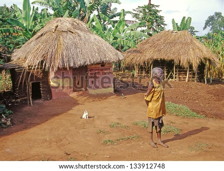 BUIKWE REGION, UGANDA - JULY 26: Traditional african huts in East Africa on July 26, 2004 in Buikwe region, Uganda. Uganda is one of the poorest countries in the world.