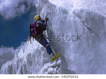 PAMIR MOUNTAINS, TAJIKISTAN - JULY 23: Climbing the ice fall under the mountain Ismoil Somoni Peak (Stalin Peak and Communism Peak), on July 23, 1990. Pamir\'s highest mountain range in Central Asia