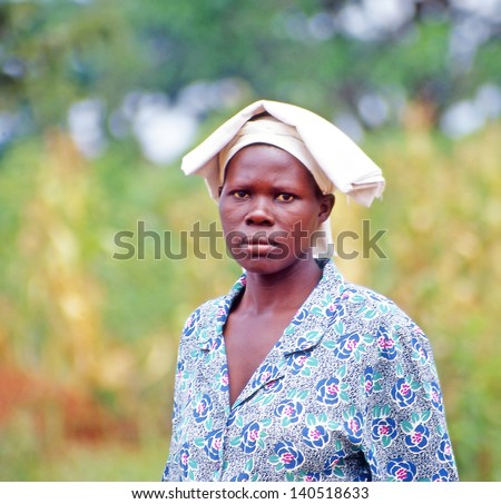 BUIKWE REGION, UGANDA - JULY 26: An unidentified farmer on July 26, 2004 in Buikwe region, Uganda. People in rural areas of Uganda depend on farming.