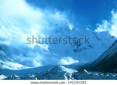 Snow avalanche of wall mount Ismoil Somoni Peak (known from 1932-1962 as Stalin Peak, and from 1962-1998 as Communism Peak), Tajikistan, Tajik National Park, World Heritage Site by UNESCO