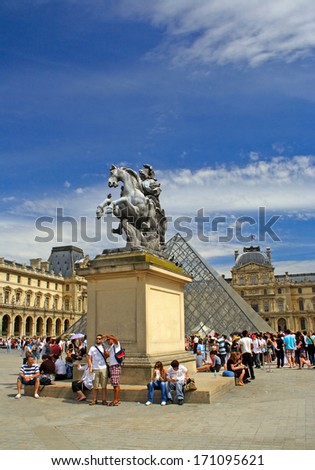 PARIS, FRANCE - AUGUST 1: Crowds of visitors at the museum in the Louvre on August 1, 2010 in Paris. Banks of the Seine from the Louvre to the Eiffel Tower is UNESCO World Heritage Site