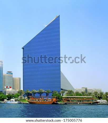 Dubai, Uae - August 15: Modern Architecture On The Banks Dubai Creek On August 15, 2004. The Creek Is Dividing The City Into Two Main Sections Deira And Bur Dubai And Stands Are Many Great Buildings