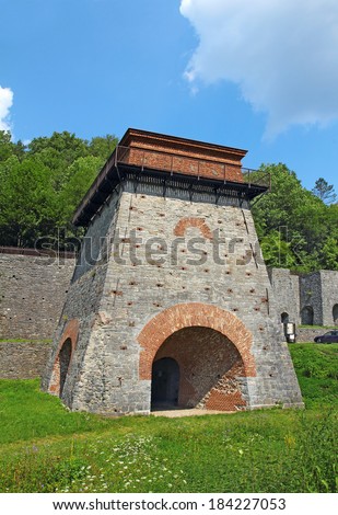 Old blast furnace for smelting iron, built in the 18th century, near Adamov, Czech Republic. The monument area of the state technical reservation with a charcoal furnace which is 10 metres high