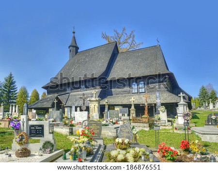 TVRDOSIN, SLOVAKIA - MARCH 29: Wooden church of All Saints in Tvrdosin town on March 29, 2014. This 15th century church is UNESCO World Heritage Site