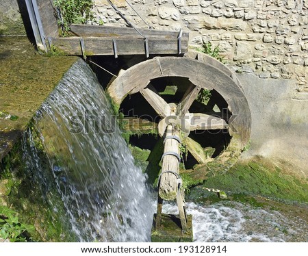 Water wheel of the old mill of medieval town Cividale del Friuli in Italy
