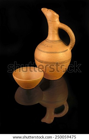Clay pitcher from Georgia - typical handicrafts on black background