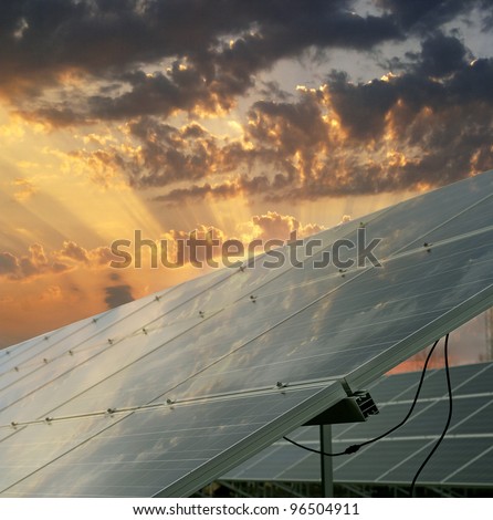 Solar power plant - Sunset over solar power station. Renewable, alternative solar energy.