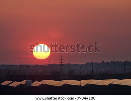 Solar power plant - Sunset over solar power station. Renewable, alternative solar energy.