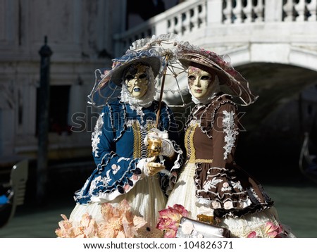 VENICE - FEBRUARY 21: Persons in Venetian costume attend the Carnival of Venice, festival starting two weeks before Ash Wednesday, on February 21, 2011 in Venice, Italy.