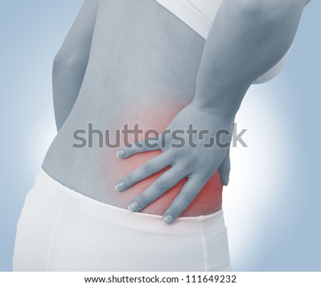 Acute pain in a woman abdomen. Female holding hand to spot of Abdomen-ache. Concept photo with Color Enhanced blue skin with read spot indicating location of the pain.