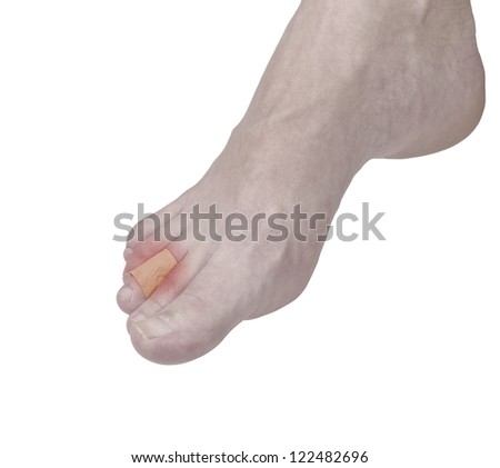 Adhesive Healing plaster on foot finger. Pain concept photo.