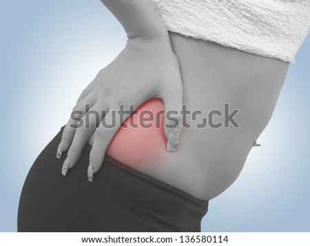 Concept photo with Color Enhanced skin with read spot indicating location of the pain.