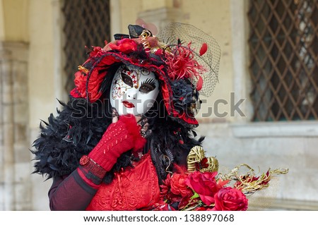 VENICE - FEBRUARY 17: Person in Venetian costume attends the Carnival of Venice, festival starting two weeks before Ash Wednesday on February 17, 2012 in Venice, Italy.