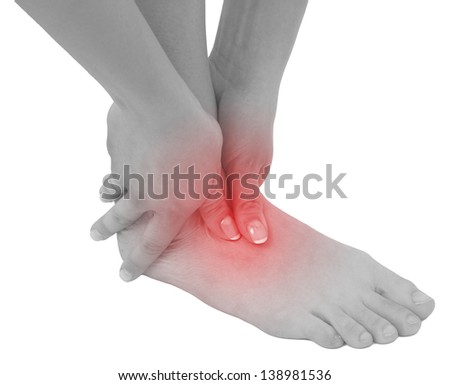 Acute pain in a woman ankle. Concept photo with blue skin with read spot indicating pain. Isolation on a white background