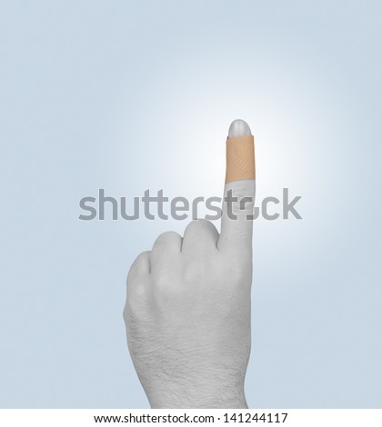 Adhesive bandage plaster on the finger.