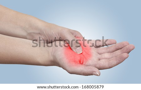 Acute pain in a woman palm. Isolation on a white background. Color Manipulation image to emphasize the pain.