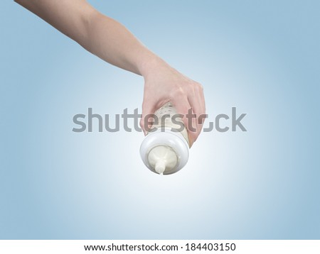 Powdered milk on spoon dairy food for baby. Isolated on white.