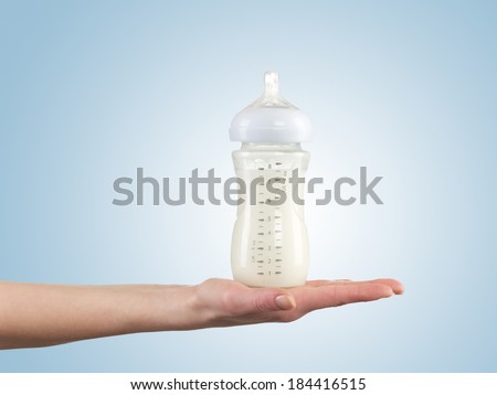 Powdered milk in bottle, dairy food for baby.