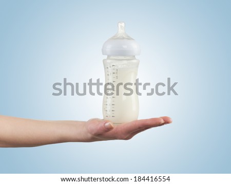 Powdered milk in bottle, dairy food for baby.