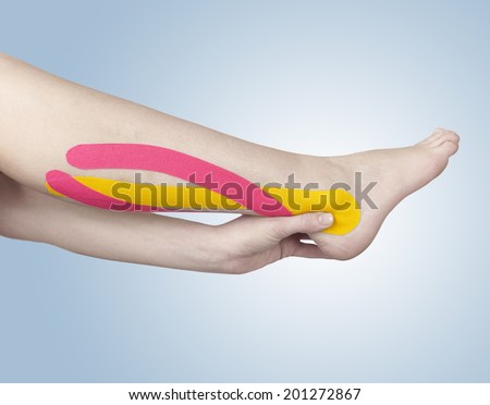 Acute pain in the calf. Woman holding hand on spot of calf aches.