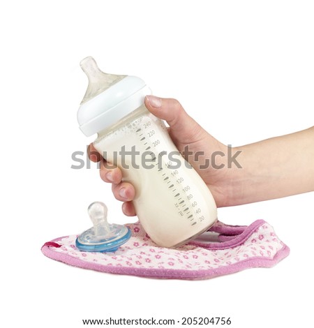 Mother prepares baby milk formula.