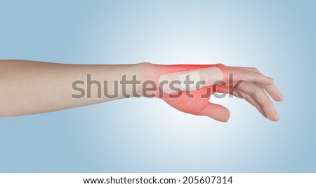 Adhesive Healing plaster on finger. Pain concept photo.