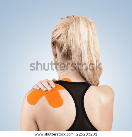 Physiotherapy treatment with therapeutic tape for shoulder pain, aches and tension. It is also used for prevention and treatment in competitive sports.