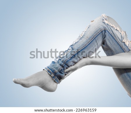 Woman massaging her Calves - Anatomy Muscles because it hurts.
