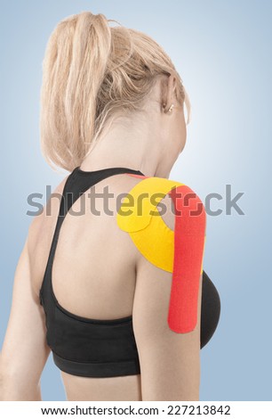Injured joint. Young female patient having shoulder pain. Medicine and health care concept.