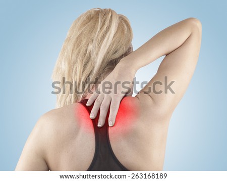 Woman holds a hand on pain neck. Backache. Medical concept