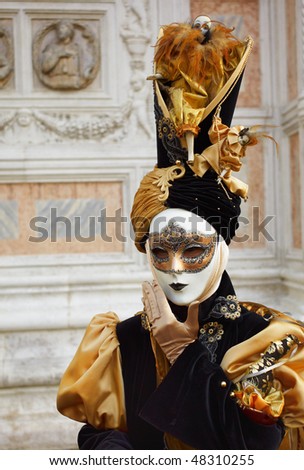 Woman in full decorative carnival costume in Venice.