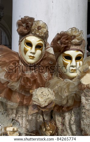 VENICE - MARCH 5: An unidentified couple in a Venetian costumes attend the Carnival of Venice, an annual festival starting around two weeks before Ash Wednesday and ends on Shrove Tuesday, on March 5, 2011 in Venice, Italy.