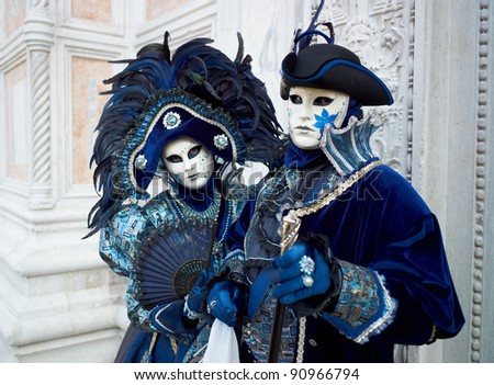 VENICE - MARCH 5: Unidentified couple in Venetian costume attend the Carnival of Venice, festival starting two weeks before Ash Wednesday and ends on Shrove Tuesday, on March 5, 2011 in Venice, Italy.