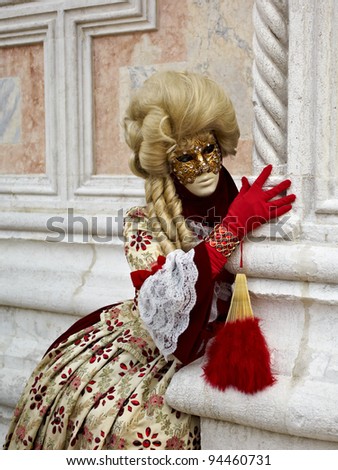 VENICE - MARCH 5, 2011: Person in Venetian costume attends the Carnival of Venice, festival starting two weeks before Ash Wednesday and ends on Shrove Tuesday, on March 5, 2011 in Venice, Italy.