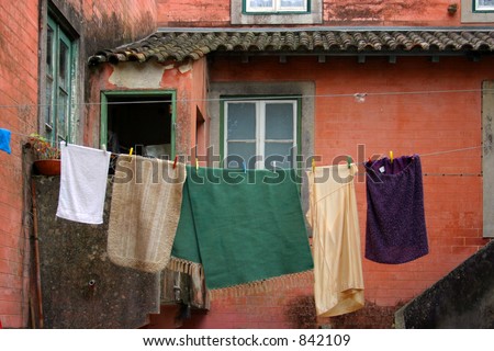 Laundry hanging out to dry behind an old Portuguese house