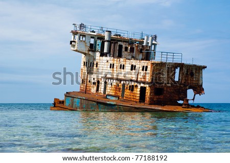 Rusty sunken ship on the Black sea coast at Dzhangul, Tarkhankut peninsula in Crimea, Ukraine