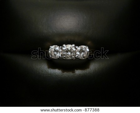 3 stone diamond ring in jewel box