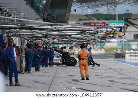 SEPANG - JUNE 10: Pit crew at work on race day at the 2012 Autobacs SUPER GT Series Round 3 on June 10, 2012 at the Sepang International Circuit, Malaysia. This race is part of the Japan GT series.