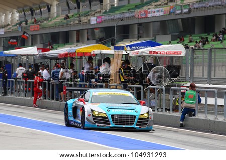 SEPANG - JUNE 9: The Audi R8 LMS car from APR team runs down the pit lane after a tire change at the 2012 Autobacs SUPER GT Series Rd 3 on June 9, 2012 at the Sepang International Circuit, Malaysia.