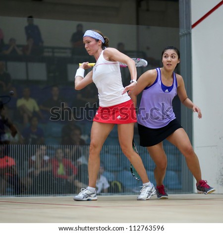 BUKIT JALIL, MALAYSIA - SEPTEMBER 11: Madeline Perry (white) defeats Delia Arnold at the CIMB Malaysian Open Squash Championship 2012 on September 11, 2012 at the National Squash Centre, Malaysia.