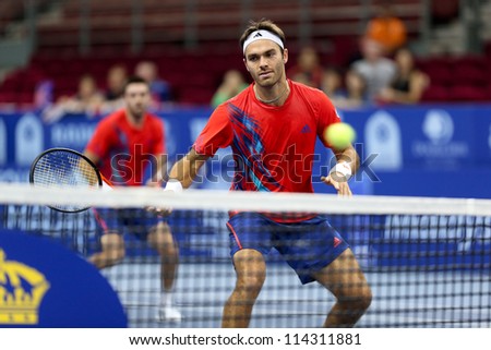KUALA LUMPUR - SEP 30: Ross Hutchins volleys in the doubles final of the ATP Tour Malaysian Open 2012 on September 30, 2012 in Kuala Lumpur, Malaysia. He partners Colin Fleming to emerge runners-up.