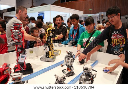 Subang Jaya - November 10: Robots Perform For Unidentified Visitors At The World Robot Olympaid On November 10, 2012 In Subang Jaya, Malaysia. This Year'S Theme Is Robots Connecting People.