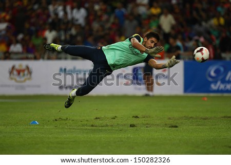 KUALA LUMPUR - AUGUST 9: FC Barcelona goal keeper Oier Olazabal dives during training at the Bukit Jalil National Stadium on August 09, 2013 in Malaysia. FC Barcelona is on an Asia Tour to Malaysia.