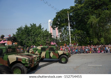 KUALA LUMPUR - AUGUST 31: Armored personnel carriers from the armor units take to the city streets in a parade as Malaysians celebrate Independence Day on August 31, 2013 in Kuala Lumpur, Malaysia.