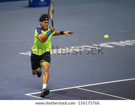 KUALA LUMPUR - SEPTEMBER 25: David Ferrer (Spain) hits a forehand return in a first round tennis match at the Malaysian Open 2013 played at the Putra Stadium, Malaysia on September 25, 2013.